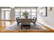 Stylish dining room with a dark wood table, comfortable seating, and neutral tones at 12526 Pembrooke Cir, Carmel, IN 46032