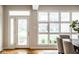 Bright entryway featuring large windows, a glass-panel door, and hardwood flooring at 12526 Pembrooke Cir, Carmel, IN 46032