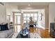 Inviting living room showcases an open floor plan to the dining area and large windows at 12526 Pembrooke Cir, Carmel, IN 46032