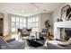 Relaxing living room area featuring neutral tones, ample seating, and bright windows at 12526 Pembrooke Cir, Carmel, IN 46032
