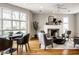 Cozy living area with a fireplace, large windows, and views to dining area at 12526 Pembrooke Cir, Carmel, IN 46032
