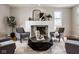 Comfortable living room featuring a fireplace and cozy seating, perfect for relaxing at 12526 Pembrooke Cir, Carmel, IN 46032