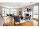 Spacious living room with a fireplace, comfortable chairs, and natural light at 12526 Pembrooke Cir, Carmel, IN 46032
