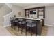 Finished basement bar with seating, shelves, and decor at 1499 Avondale Dr, Westfield, IN 46074
