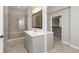 Bathroom featuring a glass-enclosed shower, double vanity, and modern finishes at 1499 Avondale Dr, Westfield, IN 46074