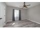 Bedroom featuring a ceiling fan, window with curtains and light wood-look flooring at 1499 Avondale Dr, Westfield, IN 46074