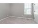 Bedroom showcasing a neutral color palette, plush carpet, and abundant natural light at 1499 Avondale Dr, Westfield, IN 46074