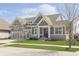 Craftsman-style home with manicured lawn and attractive landscaping at 1499 Avondale Dr, Westfield, IN 46074