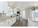 Bright, updated kitchen with granite countertops, stainless appliances, and views to the living room at 1499 Avondale Dr, Westfield, IN 46074