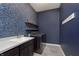 This laundry room features a sink, floating shelves and modern appliances at 1499 Avondale Dr, Westfield, IN 46074