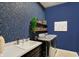 Well-organized laundry room with patterned wallpaper, modern washer/dryer, and ample counter space at 1499 Avondale Dr, Westfield, IN 46074
