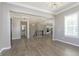 Living room features hardwood floors, a large window, and an open floor plan at 1499 Avondale Dr, Westfield, IN 46074