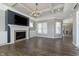 Living room showcasing fireplace, built-ins, wood floors and abundant natural light at 1499 Avondale Dr, Westfield, IN 46074