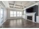 Spacious living room features a fireplace, dark wood floors, and coffered ceilings at 1499 Avondale Dr, Westfield, IN 46074