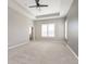 Spacious main bedroom boasts plush carpeting, tray ceiling, and neutral tones at 1499 Avondale Dr, Westfield, IN 46074