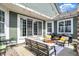 Relaxing patio area with comfortable seating, string lights, and outdoor cooking space with grills at 1499 Avondale Dr, Westfield, IN 46074