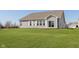 Home exterior with a large, well-manicured backyard and gray vinyl siding at 1590 Blackthorne N Trl, Plainfield, IN 46168