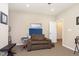 Cozy music room featuring a brown sofa, soundproofing panels, and carpet flooring at 1590 Blackthorne N Trl, Plainfield, IN 46168