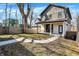 A lovely backyard with a patio, modern home, a lush lawn, and a walkway at 1603 Nowland Ave, Indianapolis, IN 46201