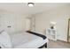 Bedroom featuring carpet flooring, closet, a queen bed and natural light from a window at 1603 Nowland Ave, Indianapolis, IN 46201