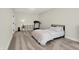Spacious bedroom featuring carpeted floors, a treadmill, and natural light from a large window at 1603 Nowland Ave, Indianapolis, IN 46201