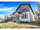 Street view of a stylish two-story home with a covered porch, showcasing its modern architecture and curb appeal at 1603 Nowland Ave, Indianapolis, IN 46201