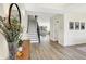 Inviting foyer with wood floors, a staircase, and views of the living room and natural light at 1603 Nowland Ave, Indianapolis, IN 46201