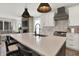 Modern kitchen with white cabinets, stainless steel appliances, and large island with bar seating at 1603 Nowland Ave, Indianapolis, IN 46201