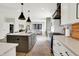 Bright and airy kitchen with a view into the living room, showcasing modern design and open layout at 1603 Nowland Ave, Indianapolis, IN 46201