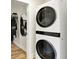 Modern stacked LG washer and dryer with closet storage at 1603 Nowland Ave, Indianapolis, IN 46201