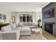 Cozy living room with a plush sectional sofa, stylish decor, and a fireplace at 1603 Nowland Ave, Indianapolis, IN 46201