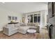 Bright living room featuring a comfortable sectional sofa, stylish rug, and sliding glass doors at 1603 Nowland Ave, Indianapolis, IN 46201
