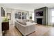 Sunlit living room with large windows, sectional sofa, fireplace and stylish decor at 1603 Nowland Ave, Indianapolis, IN 46201