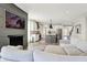 Cozy living room with fireplace, a modern kitchen view, and a comfortable gray sectional at 1603 Nowland Ave, Indianapolis, IN 46201