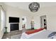 Spacious main bedroom with dark dresser and access to a bathroom and laundry at 1603 Nowland Ave, Indianapolis, IN 46201