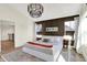 Well-lit main bedroom featuring elegant decor and a large comfortable bed at 1603 Nowland Ave, Indianapolis, IN 46201
