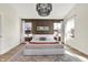 Stylish main bedroom with neutral decor, wood accent wall, and bright windows at 1603 Nowland Ave, Indianapolis, IN 46201