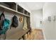 Spacious mudroom featuring built-in storage, a coat rack, and plenty of room for shoes and bags at 1603 Nowland Ave, Indianapolis, IN 46201
