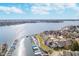 Panoramic aerial view of waterfront homes with private docks and boats, showcasing the beautiful lake setting at 20834 Waterscape Way, Noblesville, IN 46062