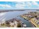 Stunning aerial view of waterfront homes with private boat docks and access to a large, serene lake under a bright sky at 20834 Waterscape Way, Noblesville, IN 46062