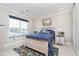 Cozy bedroom boasts a large window, and a comfortable bed with stylish decor at 20834 Waterscape Way, Noblesville, IN 46062