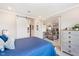 Bright bedroom leads to living area; features comfortable bed, wooden dresser and decor at 20834 Waterscape Way, Noblesville, IN 46062