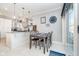 Bright dining area adjacent to the kitchen features a stylish table set and modern lighting at 20834 Waterscape Way, Noblesville, IN 46062