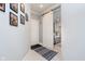 Bright hallway featuring neutral walls, a sliding barn door, and stylish decor at 20834 Waterscape Way, Noblesville, IN 46062