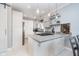 Bright kitchen features white cabinetry, stainless steel appliances, a gas range, and pendant lighting at 20834 Waterscape Way, Noblesville, IN 46062