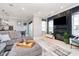Spacious living room with a fireplace, television, comfortable seating, and modern design at 20834 Waterscape Way, Noblesville, IN 46062