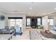 Open living space with a dining area leading to an outdoor patio and sleek, modern design at 20834 Waterscape Way, Noblesville, IN 46062