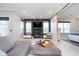Modern living room with a fireplace, sleek television, and comfortable seating at 20834 Waterscape Way, Noblesville, IN 46062