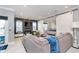 Open-concept living room flows to bedroom, with a large sofa and contemporary design at 20834 Waterscape Way, Noblesville, IN 46062