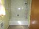 Neutral bathroom featuring tub, shower, and large, decorative paneling at 210 Evergreen St, Morgantown, IN 46160
